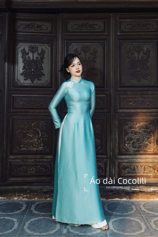 H605 Áo only no pants - Áo dài lụa vân gỗ đính cúc màu xanh da trời